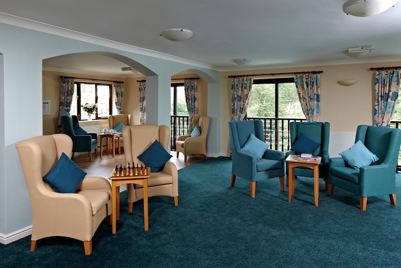 Lounge with blue armchairs and chess board